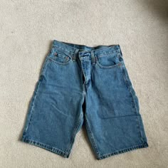 Never Worn Levi's High-waisted Blue Jean Shorts, Levi's Blue Shorts With Pockets, Blue Levi's Jean Shorts, Levi's Blue Short Leg Shorts, Levi's Blue Shorts, Levi's Mid-rise Blue Shorts, Levi's Denim Blue Shorts With Pockets, Blue Denim Jean Shorts With Short Inseam, Levi's Blue Denim Shorts