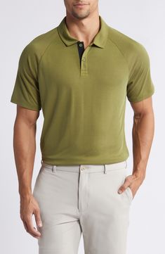 Sweat-wicking fabric brings all-activity comfort to a golf polo made of a soft piqué knit and styled to go easily from the course to the clubhouse. 27 1/2" front length; 28" back length (size Medium) Button half-placket Spread collar Short sleeves Moisture-wicking fabric engineered for dryness and comfort Reflective logo enhances visibility in low light or at night 66% rayon, 34% polyester Machine wash, tumble dry Imported Sporty Relaxed Fit Polo Shirt For Golf, Classic Polo Shirt With Seamless Collar For Golf, Classic Golf Polo Shirt With Seamless Collar, Classic Relaxed Fit Polo Shirt For Golf, Casual Go-dry Polo Shirt For Golf, Functional Collared Polo Shirt For Golf, Classic Solid Color Golf Tops, Sporty Solid Color Golf Polo Shirt, Functional Golf Tops With Polo Collar