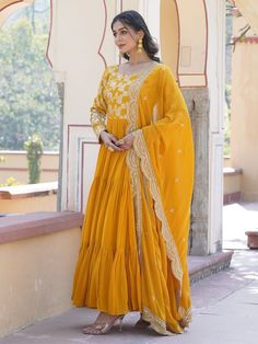 This stunning gown is perfect for any special occasion, with its vibrant yellow color and intricate sequin and embroidered work. The silk dupatta complements the gown beautifully, featuring matching sequin and embroidered work along with designer lace detailing.
Not only is it fully stitched and available in sizes XS to XXL, but it also has a generous 3.50-meter flair and a gown length of 56 inches. The 2.3-meter-long dupatta adds an elegant touch, making this ensemble a must-have for festivals, Designer Yellow Churidar With Dori Work, Yellow Churidar With Dori Work For Fashion, Yellow Chanderi Anarkali Set With Dori Work, Yellow Anarkali Set With Dori Work For Eid, Yellow Anarkali Kurta With Pallu, Designer Yellow Sharara With Chikankari Embroidery, Yellow Anarkali Salwar Kameez With Dori Work, Designer Yellow Salwar Kameez With Dori Work, Yellow Anarkali Set With Chikankari Embroidery In Dola Silk