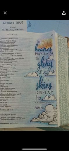 an open bible with the words of jesus on it and clouds in the sky above