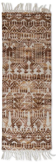 a brown and white rug with fringes