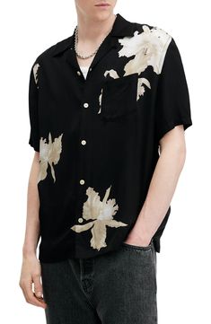 A nod to retro island styles, this camp shirt sports a grandly scaled floral print against a light, breezy fabric that feels good on a tropical day. 28 1/2" length; 46" chest (size Medium) Front button closure Convertible collar Short sleeves Chest patch pocket 100% viscose Machine wash, tumble dry Imported Allsaints Short Sleeve Tops For Summer, Allsaints Collared Summer Shirt, Allsaints Black Short Sleeve Top, Allsaints Casual Summer Shirt, Casual Allsaints Summer Shirt, Allsaints Camp Collar Top For Spring, Allsaints Casual Camp Collar Shirt, Allsaints Short Sleeve Summer Shirt, Allsaints Casual Relaxed Fit Camp Shirt