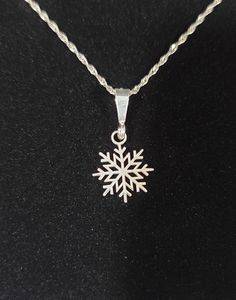 This beautiful pendant is the perfect addition to your holiday jewelry collection. The sterling silver snowflake design is intricate and eye-catching, with a rope chain that adds a touch of elegance.  The pendant is made by MAR CO JEWLERES, a trusted brand in the jewelry industry. It is crafted from 925 sterling silver and has a silver color. The pendant is designed for Christmas occasion and has a christmas theme, making it a great gift for the holiday season. The necklace is made in the United States and comes with a seller warranty for added peace of mind. Any questions please contact us Sterling Silver Snowflake Jewelry For Winter, Silver Snowflake Jewelry For Holidays, Sterling Silver Snowflake Jewelry, Sterling Silver Snowflake Necklace In White Gold, Snowflake White Gold Jewelry Gift, White Gold Snowflake Jewelry For Christmas, White Gold Snowflake Jewelry Gift, White Gold Sterling Silver Snowflake Necklace, Christmas White Gold Snowflake Jewelry