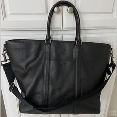 Coach Genuine Pebbled Extra Large Leather Travel Tote Black - 17.5” W X 6” D X 16.5” T, Heavy Duty Hardware, Handles Plus Wide Shoulder Strap, Zip Top, Luggage Handle Sleeve On Back, Pocket On Front And Zippered Pocket On Back, And Zippered Pocket On Side, Multiple Pockets Inside - Only Used Twice, Was Too Big For My Taste, My Loss Is Your Gain On This One, You Won’t Be Able To Tell It Isn’t Brand New- Incredible Quality And Heavy Duty Premium Leather Coach Pebbled Leather Bag For On-the-go, Classic Satchel With Pebbled Texture For Everyday Use, Pebbled Leather Tote With Palladium Hardware, Luxury Top Handle Bag With Pebbled Texture, Coach Textured Leather Travel Bag, Luxury Formal Bags With Pebbled Texture, Luxury Crossbody Bags With Pebbled Texture, Luxury Shoulder Bag With Pebbled Texture For Daily Use, Black Pebbled Leather Bag With Double Handle