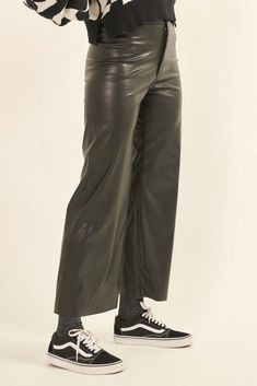 Faux leather pants. Button closure. Zipper fly. High waist. Wide leg. Unfinished, raw-edge hem. Elastic-back waist. Relaxed fit. 100% Polyester. Imported. Designed in LA. Model wears size S. Fly High, Faux Leather Pants, Raw Edge, High Waisted Pants, Black Pants, Vegan Leather, Leather Pants, High Waist, Wide Leg