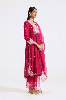 Keep it stylish on special occasions in this pink embroidered chanderi sharara suit with dupatta. Shop online from Pure Elegance. Disclaimer: The actual product may vary slightly from the image. These are custom orders, hence expect slight variation in color and placement of the motif or buta. ESTIMATED DELIVERYBecause this is a custom order, it would take about 4 weeks from the date of purchase. RETURN POLICYThis product is a custom order and cannot be returned or exchanged. Pink Palazzo Set With Resham Embroidery For Navratri, Pink Palazzo Set With Zari Work On Straight Kurta, Pink Chanderi Palazzo Set With Zari Work, Pink Chanderi Palazzo Set With Resham Embroidery, Pink Gota Work Palazzo Set For Navratri, Pink Palazzo Set With Gota Work And Straight Kurta, Pink Chikankari Embroidered Sharara With Traditional Drape, Pink Sharara With Chikankari Embroidery, Pink Dola Silk Palazzo Set With Dupatta