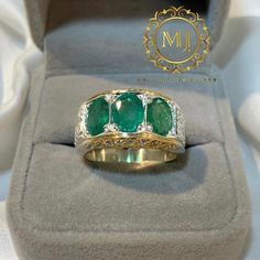 Ring Details - Natural Emeralds - Main Stone Size: 7.00x5.00 mm Approximate - Ring Front width: 13.5 mm - Band Width: 5.8 mm - Band Thickness: 2.00 mm - 1.00mm Cubic Zirconia in Setting - Rhodium Coated - Gold Plated - Gross Weight: 17.00 grams - Handmade Ring - Hand Engraved Design - Sterling Silver 925 (Hallmark) - Dimensions and Weight Depends on Variations in Sizes. - Available in all Sizes ( Please make sure about your ring sizes) - DM for Customizations NOTE: - Our Products are Made to Ord Natural Emerald Rings, May Birthstone, Natural Emerald, Emerald Ring, Hand Engraving, Rings Statement, Handmade Ring, Silver 925, Statement Rings