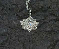 Lotus Necklace  Water Lily Necklace  Silver Lotus by spaceweaver Engraved Moonstone Pendant Necklace, Spiritual Engraved Moonstone Necklaces, Spiritual Engraved Moonstone Necklace, Engraved Moonstone Necklace For Spiritual Style, Moonstone Pendant Necklace With Oxidized Finish, Oxidized Moonstone Pendant Necklace, Symbolic Silver Moonstone Necklaces, Silver Moonstone Necklace With Symbolic Style, Silver Moonstone Necklace For Festivals