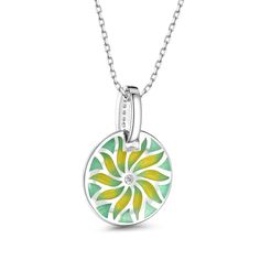 The motif of the compass flower radiating in gold loses itself in infinity, just like the sea does. A pretty necklace made from sterling silver and green&yellow enamel tones. The necklace is decorated with a delicate floral motif that radiates from its center. Elegant design.Carat Weight: 0.135 ctStone Size: 1,1.75 mmNumber of Stones: 10 Stone Shape: RoundStone Color: Diamond WhiteWeight: 3.1 gWidth: 15.9 mmHeight: 22.9 mmThickness: 4.9 mmMaterial: 925 SilverStone Type: Jeulia® StonePlating Colo Green Enamel Charm Jewelry, Green Enamel Jewelry With Charms, Green Sterling Silver Necklaces With Charms, Green Sterling Silver Necklace With Charms, Green Necklace With Large Flower Pendant, Green Flower Pendant Necklace With Large Pendant, Green Flower Charm Jewelry With Round Pendant, Green Flower Charm Round Pendant Jewelry, Green Enamel Round Pendant Jewelry