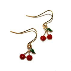 "Enamel Cherry Earrings - Handmade They measure 1\" long including hook." Red Metal Earrings For Summer, Trendy Enamel Drop Earrings, Trendy Enamel Nickel-free Earrings, Retro Enamel Earrings As Gift, Trendy Nickel-free Enamel Earrings, Cute Red Earrings With Fruit Design, Cherry Colored Drop Earrings With Ear Wire, Cherry Dangle Earrings With Ear Wire, Cherry Color Dangle Earrings