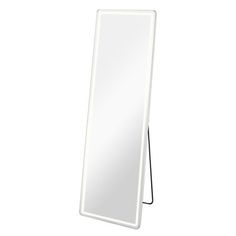 a white standing mirror on top of a wooden stand next to a black corded light