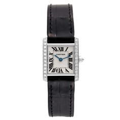 Cartier Tank Francaise White Gold Diamond Ladies Watch WE100251. Quartz movement. Rectangular 18k white gold 20.0 x 25.0 mm case. Octagonal crown set with an original Cartier factory diamond. 18k White gold original Cartier factory diamond bezel. Scratch resistant sapphire crystal. Silver dial with black radial Roman numerals. Sword shaped blued steel hands. Secret Cartier signature at X. Black leather strap with 18k white gold deployant buckle. Classic Watch With Diamond Accents And Rectangular Dial, Cartier Designer Diamond Watch, Designer Cartier Diamond Watch, Cartier Designer Diamond Watch With Diamond Hour Markers, Designer Cartier Diamond Watch With Diamond Hour Markers, Cartier Luxury Diamond Watch For Evening, Luxury Cartier Diamond Watch For Evening, Cartier Luxury Diamond Watch For Formal Occasions, Luxury Cartier Diamond Watch For Formal Occasions