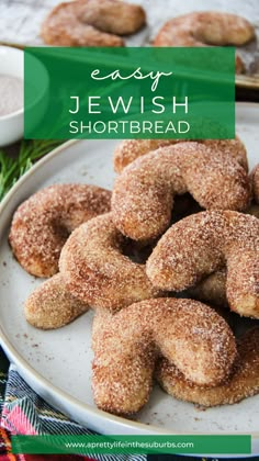 a white plate topped with donuts covered in sugar