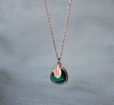 "This beautiful emerald necklace would be a perfect gift for a wedding, birthday, anniversary, graduation or for any occasion. Please click here to view the matching earrings: https://www.etsy.com/listing/751135665/emerald-earrings-may-birthstone-gift-may?ga_search_query=emerald&ref=shop_items_search_4&pro=1&frs=1 The rose gold plated emerald pendant is made of glass and is a gorgeous deep green shade. It measures approximately 12.5x 16 mm and is hung on a 16\", 18\" or 20\" chain. P Wedding Necklace With May Birthstone, May Birthstone Wedding Necklace, Wedding Emerald Birthstone Necklace, Wedding May Birthstone Necklace, Personalized Green Round Pendant Necklace, Rose Gold Birthstone Necklace For May Birthstone Gift, Rose Gold Birthstone Necklace For May, Gift, Green Birthstone Necklace For May Birthday Gift, Emerald Round Pendant Necklace As Gift