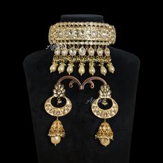 Polki Kundan Necklace inspired by Sabyasachi Iconic designs. This Moissanite Kundan Polki Choker Showcases a fusion of Jadau and Pearls influences, timeless elegance. This Kundan Choker is a masterpieces of any Traditional look. You can pair it with any Black or Red silk saree with Sattle make-up. *𝐏𝐑𝐎𝐃𝐔𝐂𝐓 𝐃𝐄𝐓𝐀𝐈𝐋* * Material: Brass * Plating: Gold Plated * Stone: Semi Precious Kundan, Pearl & Polki. *𝐃𝐈𝐌𝐄𝐍𝐒𝐈𝐎𝐍𝐒* * Necklace- Weight: 82 gm,Length:5.5 Inches, Width: 3.2 Inche Elegant Gold Lehenga With Cutdana, Elegant Gold Lehenga With Intricate Design, Festive Formal Kundan Tikka, Diwali Bridal Sets With Intricate Design For Reception, Elegant Ceremonial Kundan Lehenga, Bridal Sets With Intricate Design For Diwali Reception, Intricate Bridal Sets For Diwali Reception, Elegant Traditional Wear With Intricate Design For Reception, Elegant Heavy Lehenga For Diwali