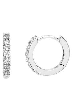 Wrapped in fiery sparkle, these huggie-style hoops add the ideal glint to your ensemble. 1/2" hoop diameter; 1/8" width Snap-post back Goldtone plate or silvertone plate/cubic zirconia Imported Huggie Hoop Earrings, Cubic Zirconia, Silver Tone, Gold Tones, Jewelry Earrings, Hoop Earrings, Sparkle, Nordstrom, Women Jewelry