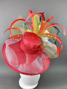 Red Feathered Fascinator For Kentucky Derby, Red Feathered Hat For Races, Red Feathered Costume Hat For Races, Red Brimmed Summer Fascinator, Red Brimmed Fascinator For Summer, Red Curved Brim Fascinator For Garden Party, Red Feathered Fascinator Hat, Red Feathered Hat Fascinator, Red Adjustable Fascinator For Garden Party