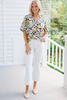 This bold top is so much fun! We absolutely love that vibrant, colorful floral print! The oversized, light fit is also perfect for the warm summer months! This top is going to look fab with white shorts or even white linen pants. V-neckline Short sleeves Paisley print Oversized fit No stretch Payton is wearing the small. Summer Rayon Top With Relaxed Fit, Summer Multicolor Tops With Bold Print, Chic Summer Blouse With Vibrant Print, Casual White Top With Tropical Print, White Tropical Print Tops For Day Out, Casual Cotton Blouse With Tropical Print, Relaxed Fit Summer Tops For Brunch, Multicolor Tropical Print Top For Summer, Trendy Summer Floral Print Blouse