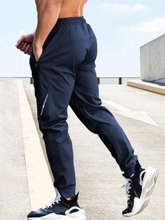 Waist Line:Natural \nFit Type:Regular Fit \nType:Sports Pants \nColor:Blue \nPattern Type:Letter \nLength:Long \nFabric:Slight Stretch \nMaterial:Fabric \nComposition:96% Polyester \nComposition:4% Elastane \nCare Instructions:Machine wash or professional dry clean \nSheer:No \n Men Sport Pants, Boyfriend Style, Sports Pants, Yoga For Men, Outdoor Men, Mens Activewear, Mens Swimwear, Sport Pants, Maternity Bag