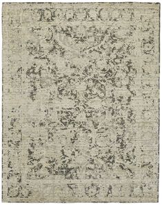 an area rug with grey and white colors