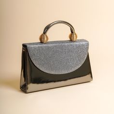 The sides and chain strap of this wedding clutch bag made of faux leather and glitter fabric are silver colored. Basic make-up supplies, cell phone, key chain, credit card and money can easily fit into this luxury mini bag. The interior of this evening bag has a single compartment and is lined with suede. It has a 120 cm removable chain strap. This wedding clutch is completely handmade. Features: Faux leather and glitter fabric. Fits basic makeup, cell phone, key chain, credit card and money. Su Party Tote Shoulder Bag With Adjustable Handle, Silver Shoulder Box Bag For Party, Party Handheld Shoulder Bag With Detachable Strap, Handheld Party Shoulder Bag With Detachable Strap, Party Tote Bag With Adjustable Handle, Party Shoulder Bag With Detachable Handle, Party Pouch Shoulder Bag With Detachable Handle, Silver Rectangular Bag With Handles, Silver Handheld Bag With Handles