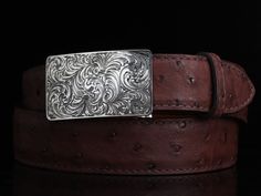 One of our most popular buckles, this understated piece by Comstock Heritage is perfect for those just starting their buckle collections, or for more formal occasions. It’s made from heavy-gauge, hand-engraved Sterling silver, and its rectangular face is adorned with beautiful, delicate scrollwork. This buckle can be paired easily blue jeans or be worn with dressier slacks. Smaller size measures 1 ⅝” x 2 ⅝” and fits all 1 ¼" belt traps Larger version measures 1 ⅞” x 2 ¾" and fits all 1 ½" belt s Western Engraved Belt For Formal Occasions, Western Style Engraved Belt For Formal Occasions, Western Engraved Belt Buckles For Formal Wear, Western Style Antique Belt Buckle For Formal Wear, Western Style Antique Belt Buckle For Formal Occasion, Western Engraved Jewelry For Formal Occasions, Vintage Engraved Belt Buckles For Formal Occasions, Silver Western Belt Buckles For Formal Occasions, Classic Engraved Belts For Formal Occasions