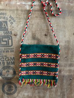 Another fun spirited bag.  Handwoven, tassel adorned, multi-colored, featuring yellow, red, black, green and white and braided green, yellow, and green strap.  This cross body/shoulder bag is very durable, the inner lining is made of thick like canvas material.  Great for any kind of adventure.  Enjoy & wear it well. :) Measurements:  Length:11.5" Width: 13.5"9(includes tassel) Condition: Excellent! Traditional Green Shoulder Bag For Festival, Artisan Green Bags For Festival, Artisan Green Shoulder Bag For Travel, Green Everyday Bags For Festivals, Traditional Green Shoulder Bag For Daily Use, Traditional Green Shoulder Bag For Everyday, Artisan Green Bag For Festival, Bohemian Green Shoulder Bag For Daily Use, Green Bohemian Shoulder Bag For Daily Use