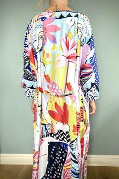 Beautiful handmade vintage / Boho style kimono robe, ideal for fashion at home or wear over jeans & tee. Beach cover up, multi coloured Art print design.Lovely, floaty, soft silky fabric, ideal for covering up on the beach or throw over pyjamas. Pretty multi colour design, features flowers, ladies faces, and modern art styling. Free size fits from UK size 8 to size 16machine washable Printed Beach Dress For Spring Holiday, Multicolor Long Sleeve Dress For Beach Party, Tropical Multicolor Dress For Day Out, Vibrant Multicolor Print Dresses For The Beach, Vibrant Multicolor Print Dresses For Beach, Vibrant Multicolor Print Beach Dresses, Vibrant Print Patterned Dresses For Beach Season, Multicolor Floral Print Maxi Dress For Festival, Long Sleeve Multicolor Print Beach Dress