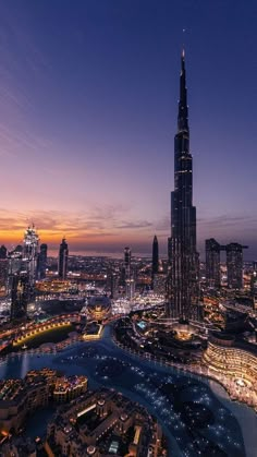 an aerial view of the burj tower at night in dubai, united kingdom