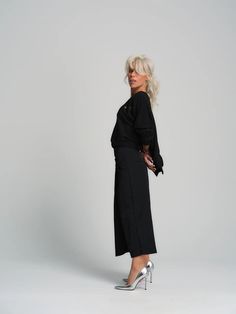 Our pants have an oversized boxy silhouette and a cropped length, the perfect combination of relaxed and stylish. Wear yours with your favorite funky top. We are bringing discreet chic back with our elevated black top. The subtle eyelet details and asymmetric hem lend this piece a subversive edge that’s easy to style in various looks. 100% Handmade products. SIZE & FIT:Fit: A relaxed fit with room to moveModel is wearing size Small or S/MView our SIZE CHART before ordering MATERIALS & CARE: PANTS: 100%Polyester TOP: 65% Cotton, 35% Polyester Care: Machine wash on cold (30ºC) with a mild detergent.SHIPPING:Made to order, processing time is 15 working daysThis item will be shipped via DHL Chic Cropped Pants For Fall, Casual Cropped Pants For Party, Chic Relaxed Fit Sets For Fall, Oversized Chic Bottoms For Fall, Chic Cropped Bottoms For Work, Chic Oversized Bottoms For Fall, Cropped Wide Leg Pants For Work In Fall, Chic Oversized Straight Pants, Chic Relaxed Fit Crop Top For Loungewear