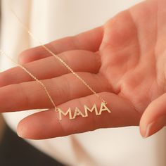 14K Solid Gold Diamond Mama Necklace, Cz Zircon Mama Necklace, Dainty Delicate Plain Gold Mama Necklace is a Great Mother's day Gift for Mom. Material: Solid Gold (no gold filled or no gold plated material) Karat: 14 K (585) Mama Pendant Height: 7 mm (0.28 inches) Mama Pendant Width: 2.5 - 2.60 cm (0.98 - 1.02 inches) Measurements may vary due to handwork. Diamond Mom Necklace >> Diamond Weight: 0,06 - 0,08 ct >> Number of diamonds: 10 >> Diamond Color: G - H color >> Dia Personalized Diamond Jewelry For Mother's Day, Mother's Day Cubic Zirconia Clavicle Chain Necklace, Cubic Zirconia Clavicle Chain Necklace For Mother's Day, Elegant Cubic Zirconia Name Necklace For Gift, Elegant Cubic Zirconia Name Necklace As Gift, Engraved Diamond Jewelry For Mother's Day, Mother's Day White Gold Nameplate Jewelry, Elegant Necklace With Diamond Accents For Mom, Mother's Day Engraved Diamond Jewelry