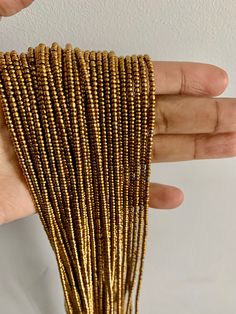 Beaded gold waist beads! Gives a vibrant golden radiant on your waist!! Gorgeous on any skin tone! These waist beads have metallic clasps. Waist beads, Boho Jewelry, African waist beads, Belly Chain, Belly Beads PROPERLY MEASURE YOUR WAIST Place the measuring tape at the exact area you prefer to wear the waist beads. Do not tuck in your stomach when measuring for belly chain. Allow for wiggle space when measuring for breathing room. Thank you for shopping with us! Gold Beaded Bracelets With Tiny Beads For Party, Gold Necklaces With Polished Metal Beads, Gold Necklaces With Metal Beads, Gold Metal Beaded Chain Necklace, Gold Beads With Beaded Chain For Party, Gold Beaded Chain Beads For Party, Gold Metal Beads Necklace For Jewelry Making, Gold Beaded Chain For Party, Adjustable Gold Beaded Chain Waist Beads