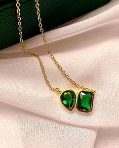 Green Drop Necklaces For Party, Green Drop Necklace For Party, Elegant Gold Emerald Necklace Gift, Elegant Gold Emerald Necklace As A Gift, Elegant Green Jewelry With Delicate Chain, Elegant Gold Plated Emerald Necklace For Gift, Elegant Dangle Emerald Necklace Gift, Green Drop Necklaces In Fine Jewelry Style, Elegant May Birthstone Necklace With Rectangular Pendant