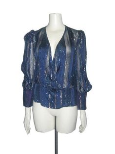 Vintage Blue Metallic Gold Striped Sheer Panels Glitter Buttoned Surplice Puff Sleeve Shoulder Pads Peplum Disco Blouse Size: N/A Pictured on a mannequin that measures 34 1/2" bust 24 1/2" waist and 35" hip  Measurements   Length: 24"  Shoulder: 14"  Bust:  17 1/2"  Waist:  14 1/2"  Bottom Opening: 18"  Sleeve Length:  23" In good used preowned vintage condition      Please contact me with any questions regarding this item Glitter Blouse For Evening, Fitted Glitter Blouse For Evening, Fitted Glitter Blouse For Party Season, Glamorous Blue Tops For Party Season, Blue Sequined Tops For Fall, Blue Sequin Top For Fall, Blue Fall Party Blouse, Glamorous Fitted Blouse With Puff Sleeves, Glamorous Puff Sleeve Tops For Evening