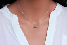 "Sterling Silver Cross Necklace - Religious Jewelry - Tiny Sterling silver CZ Cross Necklace - Layering Necklace Dainty Cross Necklace - Gift for Her ★★The necklace makes of .... -Sterling Silver 9.4x17.5mm Small CZ Cross Pendant, 3.2mm Closed Ring Sterling silver cable chain with spring claw . -Total length will be 16\" 17\" 18\" or 19\" depend on customer request. -Come up with beautiful ribbon gift box -One set of care instruction package that enhance your present ... All quantities are avail Sterling Silver Cross Pendant Necklace For Wedding, Sterling Silver Cross Necklace For Wedding, Elegant Silver Cross Necklace For Wedding, Silver Cross Necklaces For Wedding, Elegant Silver Chain Cross Necklace Gift, Elegant Silver Cross Charm Necklaces, White Gold Sterling Silver Cross Necklace For Wedding, Wedding White Sterling Silver Cross Necklace, Silver Chain Cross Jewelry Gift