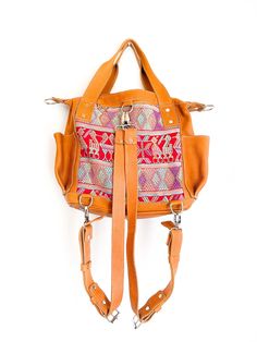 Convertible full grain leather bag with removable straps to wear in three different ways. Includes leather cross body strap and a pair of backpack straps. This mini backpack is made using a traditional huipil from the village of Chichicastenango, Quiché. - 100% foot loomed cotton lining - Artisan made woven huipil- One interior zipper pocket, zipper closure- Hand sanitizer included as in picture- Inside Pockets- Two exterior open pockets - Full camel grain leather - Zipper closure * This bag is Leather Tote Shoulder Bag With Adjustable Straps, Leather Shoulder Bag Tote With Adjustable Straps, Everyday Bohemian Bag With Strap, Bohemian Crossbody Bag With Strap, Bohemian Everyday Bag, Bohemian Everyday Bag With Strap, Bohemian Leather Shoulder Bag With Detachable Strap, Bohemian Shoulder Bag For Daily Use, Bohemian Rectangular Bag With Strap