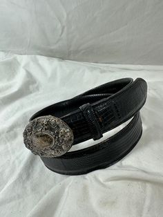 You are looking at genuine lizard belt with sterling silver buckle. Belt measures 37"72 long with 29"4 from the first perforation and 34"4 at its last perforation from buckle and 1"1 width. The front buckle measures approximately 2"7 x 1"6 and has lovely patina. The lizard belt and buckle is a great vintage find and will last you for years to come.  Shipping Shipping is done with USPS priority mail within the U.S. and shipping takes 4-5 business days from the date of payment. Please note I do co