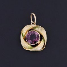 This charm features a purple glass doublet set in 10k gold, adorned with pale green enamel.  The charm was originally an antique stick pin (circa 1900) that our jeweler transformed by removing the pin stem and adding a jump ring bail.  The charm measures 0.75 inches from the top of the jump ring to bottom by 0.5 inches wide, and it is in great condition. We have many other fantastic offerings of antique and vintage jewelry posted on our Etsy store, so please consider browsing our other items. We 14k Stamped Art Deco Jewelry Gift, Purple Enamel Pendant Jewelry, Art Deco 14k Gold Pendant Jewelry, Collectible Yellow Gold Jewelry For May Birthstone, Antique Enamel Charms Jewelry, Art Nouveau Yellow Gold Jewelry Gift, Yellow Gold Jewelry Collectible For May Birthstone, Collectible Art Nouveau Yellow Gold Jewelry, Victorian Yellow Gold Jewelry For May Birthstone