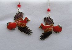 This pair of colorful Cardinals will have you ready to lend an ear for each is made of sterling silver with vibrant, cloisonné enamels and sports a red, Swarovski crystal atop each wing for added interest. Each earring measures 1.5 inches in length from the French hook ear wire to the bird's wingtip and is .75 inch in width from beak to tail. You'll find them to be in excellent, like new condition and although the back is covered with enamel they are guaranteed to be of sterling character. Even Red Enamel Pierced Earrings, Red Pierced Enamel Earrings, Handmade Red Enamel Jewelry, Red Enamel Earrings, Red Enamel Collectible Jewelry, Cardinal Jewelry, Cardinal Earrings, Peacock Ring, Christmas Stencils