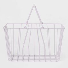 a white wire basket hanging on the wall