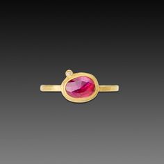 This deep, dark pink, rose cut ruby, in a slightly organic oval shape, is wrapped in 22k gold and accented with a single sparkling diamond dot. Stone measuring approximately 5mm x 8mm is set on a 2mm 18k gold hammered band. Matte finish. Oval Ruby Rings With Single Cut Diamonds, Oval Yellow Gold Birthstone Ring With Rose Cut Diamonds, December Gift, Hand Painted Gifts, Hammered Band, Hand Painted Jewelry, Painted Jewelry, Ring With Diamond, Gold Ring Stack