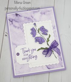 a purple and white card with flowers on it