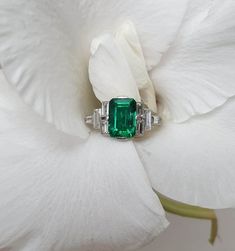 4 CT Green Emerald Cut Side Baguette Cut Multi Stone Engagement Ring 10K 14K 18K Solid White and Rose Gold Wedding Ring Anniversary Ring Bridal Ring R I N G M E T A L ✥ Metal :  925 Sterling Silver, 10K 14K 18K Solid White Yellow and Rose Gold ✥ Metal Clarity : Pure ✥ Stamp/Hallmark : Yes M A I N S T O N E S ✥ Type : Moissanite Diamond ✥ Shape : Emerald Cut ✥ Weight : 4 Ct ✥ Diamond Color : Green ✥ Clarity : VVS1 ✥ Diamond Cut : Excellence S I D E S T O N E S ✥ Type : Moissanite Diamond ✥ Shape : Baguette Cut ✥ Weight :  1.85  Ct ✥ Color : White ✥ Clarity : VVS1 ✥ Cut : Very Good R I N G S I Z E S ✥ All Ring Size are Available ✥ If You Have any Questions With Regards to Sizing Please Contact as S H I P P I N G ✥ Free Express Delivery ✥ No Extra Charge For Delivery  ✥ Fastest  Delivery Avai Octagon Emerald Ring In Platinum For Wedding, Octagon Emerald Platinum Ring For Wedding, Art Deco Emerald Ring In Baguette Cut White Gold, Classic Emerald Ring With Baguette Diamonds For Anniversary, Wedding Baguette Cut White Gold Emerald Ring, Wedding White Gold Emerald Ring Baguette Cut, Baguette Cut Emerald Ring For Anniversary, Classic Emerald Ring With Baguette Diamonds For Wedding, Rectangular Emerald Ring In White Gold For Wedding