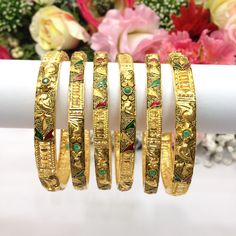 Handmade Indian Bridal Jewellery 22ct Micro Gold & Rhodium Plated 6 Bangles  Pakistani Indian Gold Plated Jewelry Set Of 6 PLEASE NOTE, This Item Is Not Real Gold .Only Good Quality Gold Plated Jewellery .This is Artificial Jewellery.  Traditional Indian Wedding Jewellery Slight Colour variations possible due to difference in screen and photograph  It is a perfect match with formal attire on special occasions or with casual wearing Care instructions Keep Jewellery away from direct heat, water, perfumes, deodorants and other strong chemicals as they may react with the metal or plating. The plating composition of Jewellery is as such that  perspiration (sweat) will not damage it. Wipe Jewellery gently with chamois cloth or leather swatch after every use. Wiping the jewellery with a soft clot Hand Set 22k Gold Festive Bracelets, Traditional Gold Plated Hand Set Bangle, Traditional Hand Set Gold Plated Bangle, Gold Cutdana Bangle For Formal Occasions, Traditional Gold Plated Bangle For Puja, Yellow Gold Meenakari Bracelets For Festivals, 22k Gold Cutdana Bracelet For Gift, Traditional Meenakari Gold-plated Bracelets, Traditional Yellow Bracelets For Diwali