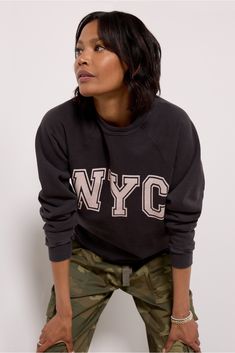 Stay cozy in the NYC Sweatshirt from Retro Brand Black Label, featuring a crew neckline, an oversized fit, and bold letting across the front. Pair with cargo pants and sneakers for a comfortable but trendy look. Nyc Sweatshirt, Parachute Pant, Look Retro, Retro Brand, Shoe Size Conversion, Stay Cozy, Black Label, Crew Neckline, Cargo Pants