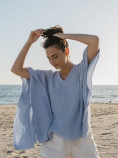 The perfect top to throw on with vintage Levi’s for running around town or doubles as an airy beach coverup. Made in a super soft cotton double gauze with raw edge trim. Takes you from beach to bar and from Summer to Fall. One Size Body length from shoulder 25.5” Body width flat 27” Delicate wash, tumble dry low *Raw edges are intentional on this garment. Please snip loose threads as necessary and wear with joy! Consciously made in small batches in sunny California using deadstock fabrics and re Sunny California, Summer To Fall, Double Gauze, Vintage Levis, Slow Fashion, Autumn Summer, Recycled Materials, One Size Fits All, Sustainable Fashion