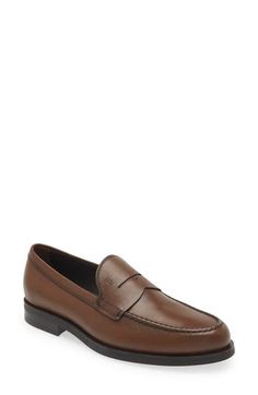 A classic keeper strap and exposed hand-stitching add a refined touch to a sharp Italian loafer crafted in semiglossy calfskin leather with a pebbled sole. Leather upper and lining/rubber sole Made in Italy Designer Shoes Semi-formal Leather Loafers With Brogue Detailing, Semi-formal Moc Toe Calf Leather Loafers, Italian Loafers, Semi-formal Brown Loafers With Stitched Sole, Luxury Gentleman's Semi-formal Loafers, Penny Loafers Men, Brown Loafers With Rubber Sole, Medium Width, Penny Loafers, Loafers Men