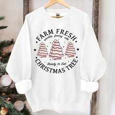 a white sweatshirt that says farm fresh christmas tree