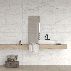 a bathroom with white marble walls and flooring