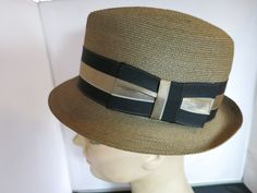 Vintage Kevin McAndrew Imported Picot Fedora Hat Size 7. Tagged inside Kevin McAndrew hat Maker by Appointment. The leather sweatband reads Shephard & Hamels, Burlington, VT and Kevin McAndres Imported Picot. Has size 7 tag. Fantastic formed, shaped and trimmed hat.  Features a pinched center dent crown with an elegant stripe ribbon bow hatband. Leather Sweatband. One spot on outer top, which, may not be a spot, rather natural color. Over all very awesome hat. Please ask any questions. Please se Retro Adjustable Brimmed Boater Hat, Adjustable Brimmed Retro Boater Hat, Retro Brown Hat Bands For Summer, Vintage Brown Adjustable Panama Hat, Brown Retro Summer Hat Bands, Retro Adjustable Straw Hat With Short Brim, Retro Adjustable Fedora Hat Band, Adjustable Retro Fedora Hat Bands, Vintage Adjustable Cap Straw Hat